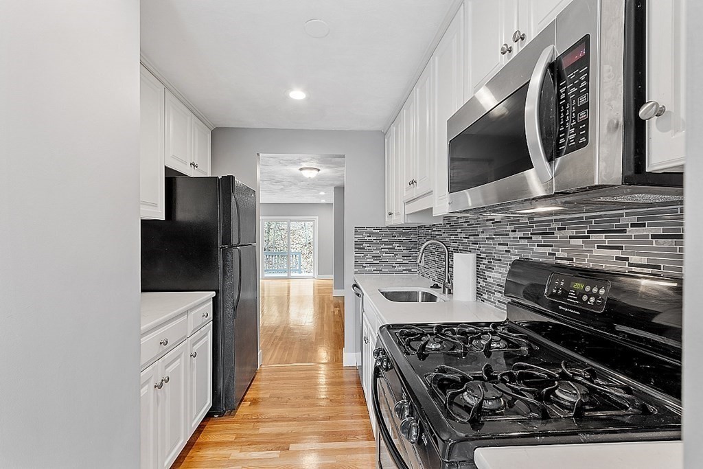 31 Blithewood Avenue, Unit 705 Worcester, MA 01604 - Photo 10 of 31 a kitchen with stainless steel appliances granite countertop a stove and a refrigerator