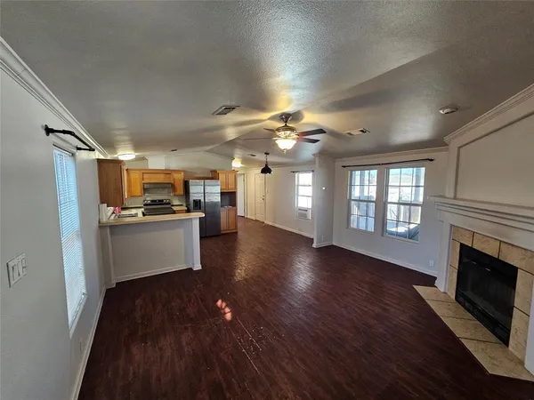 a view of kitchen with cabinets and wooden floor