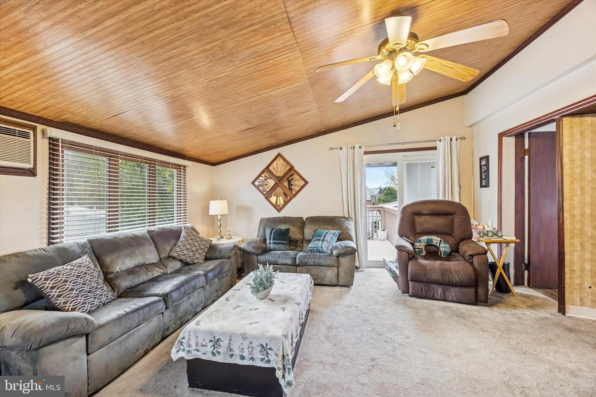 1601 Burmont Road Drexel Hill, PA 19026 - Photo 11 of 22 a living room with furniture ceiling fan and a rug