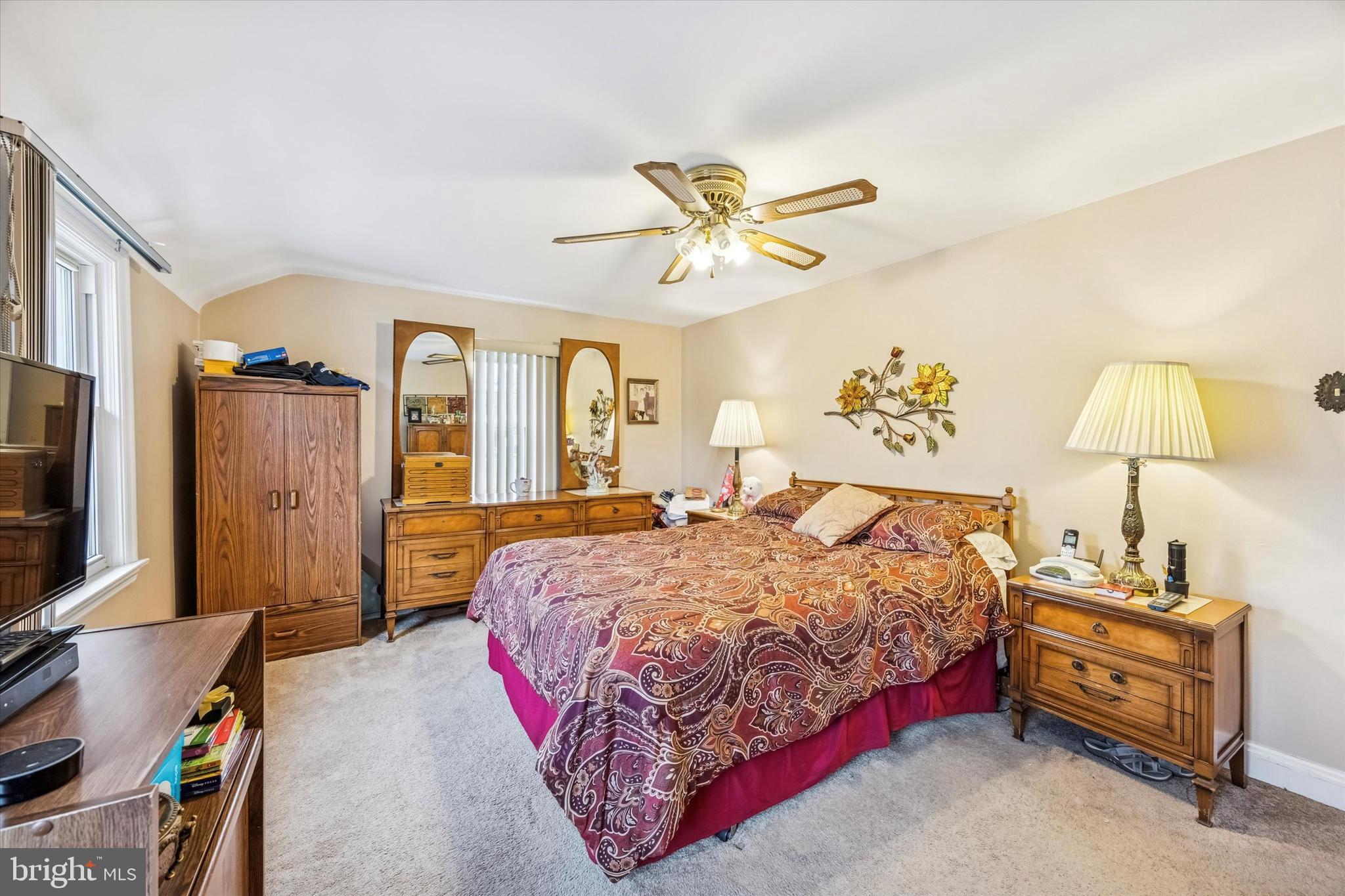 1601 Burmont Road Drexel Hill, PA 19026 - Photo 14 of 22 a bedroom with a bed and a chandelier