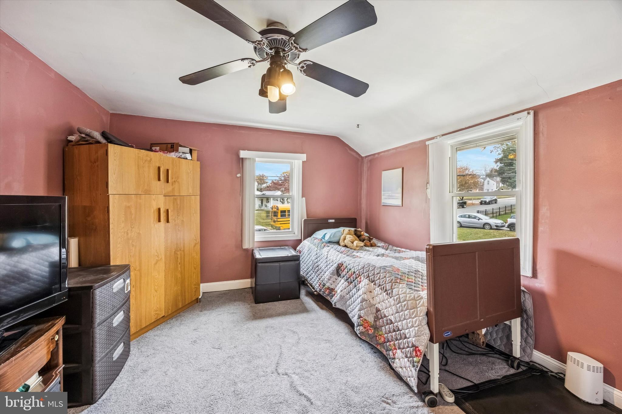 1601 Burmont Road Drexel Hill, PA 19026 - Photo 17 of 22 a bedroom with a bed dresser and a window