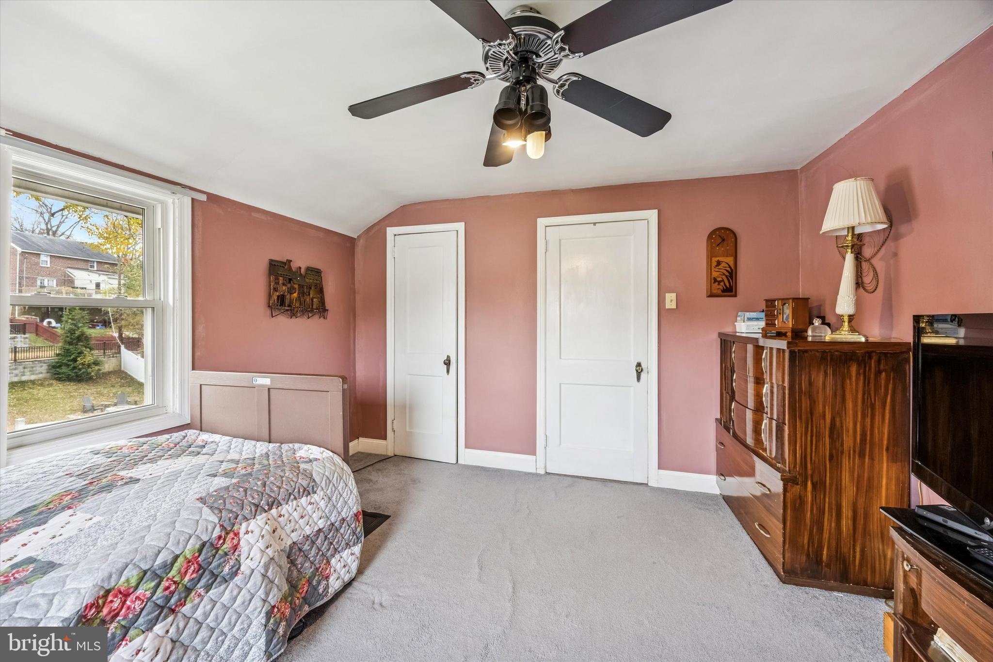 1601 Burmont Road Drexel Hill, PA 19026 - Photo 18 of 22 a bedroom with a bed dresser and a flat tv screen