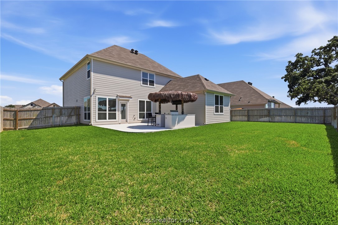 1922 Viva Road Bryan, TX 77807 - Photo 37 of 45 Expansive backyard featuring an upgraded and extended patio with cool coat decking, plus rare privacy with no back neighbors backing to a ranch.