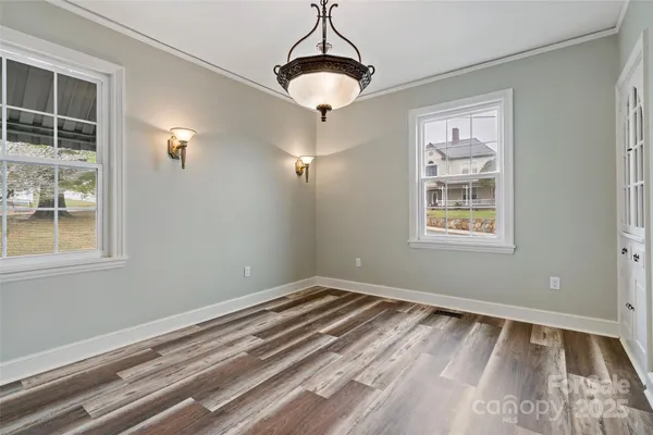 a kitchen with a sink appliances and cabinets