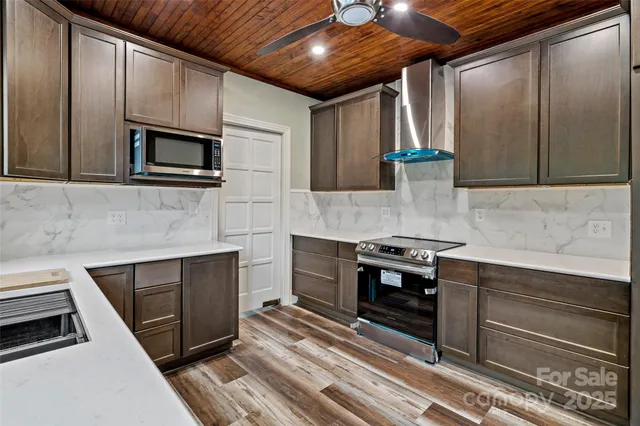 a view of room with window and wooden floor