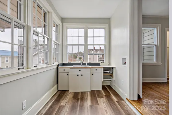 a view of a balcony with wooden floor