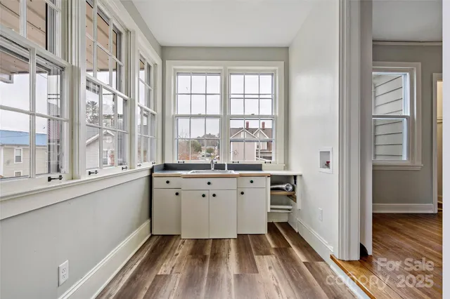 a view of a balcony with wooden floor