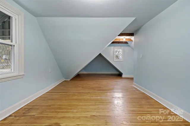 a bathroom with a sink a toilet a shower and a mirror