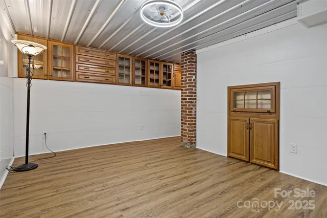 a kitchen with stainless steel appliances granite countertop a refrigerator and a stove