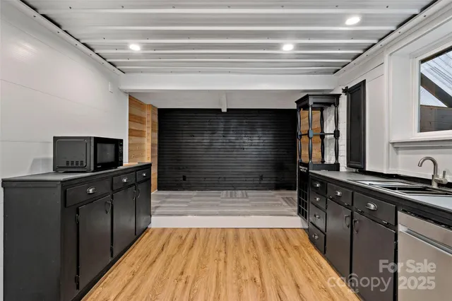 a bathroom with a toilet sink and glass door