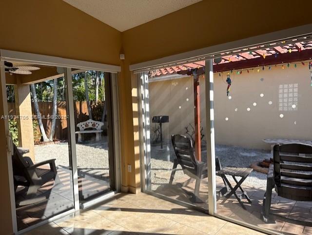 15561 Southwest 144th Terrace Miami, FL 33196 - Photo 4 of 10 a view of a livingroom with a patio and glass door