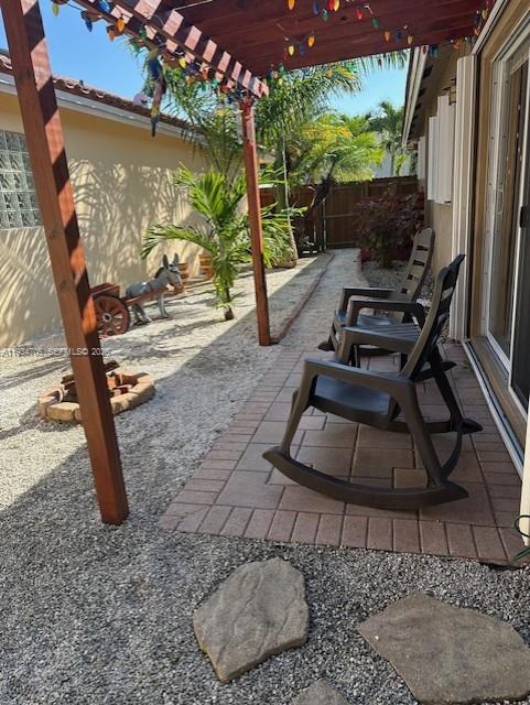 15561 Southwest 144th Terrace Miami, FL 33196 - Photo 10 of 10 a backyard of a house with seating space