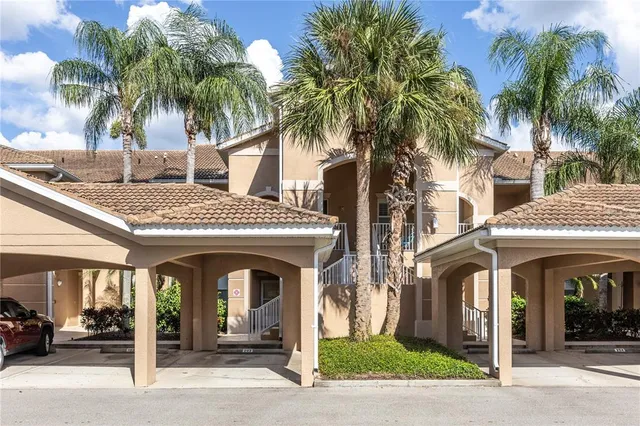 a view of a building with a palm tree