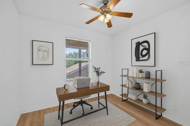 a view of a workspace with furniture