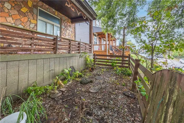 a backyard of a house with lots of green space