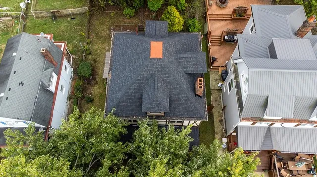 an aerial view of residential houses with outdoor space