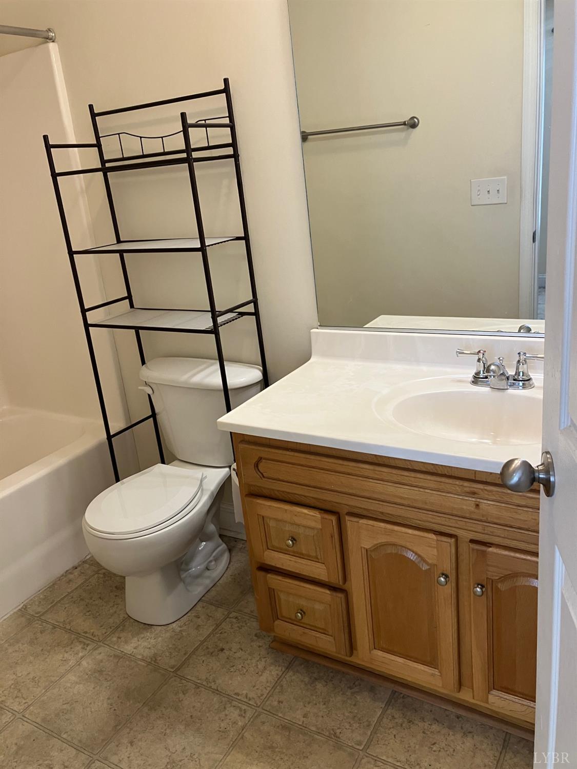 1600 Wards Ferry Road, Unit 103 Lynchburg, VA 24502 - Photo 13 of 23 a bathroom with a toilet a sink and a shower
