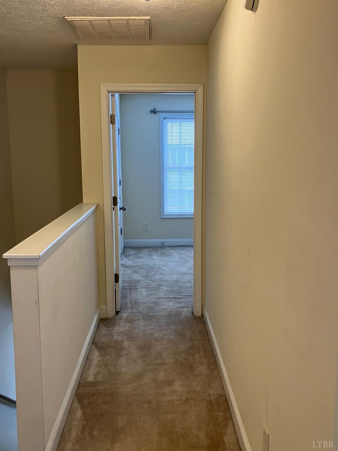 1600 Wards Ferry Road, Unit 103 Lynchburg, VA 24502 - Photo 18 of 23 a view of a hallway with a white door and a wooden door