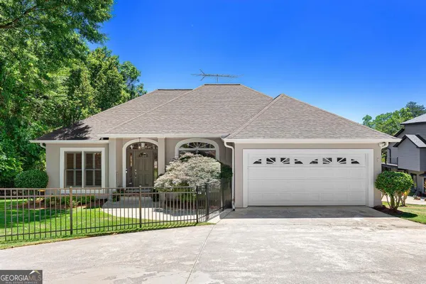 a front view of a house with a garage