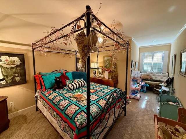 a bedroom with two beds and a window