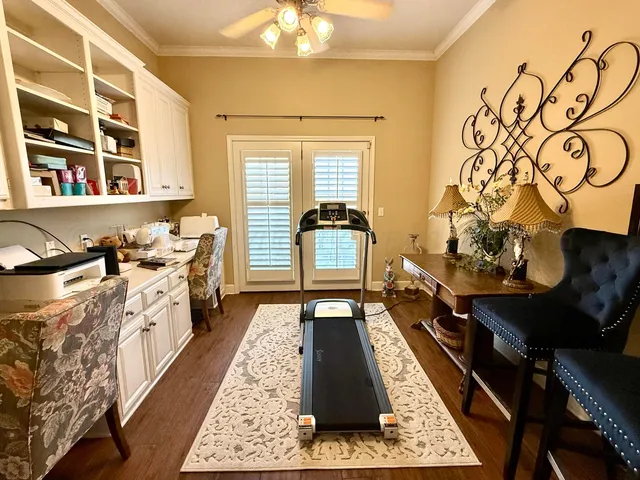 a view of a chairs and table in the balcony