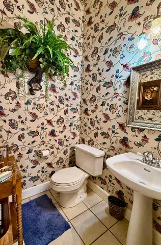 a kitchen with a refrigerator and a sink