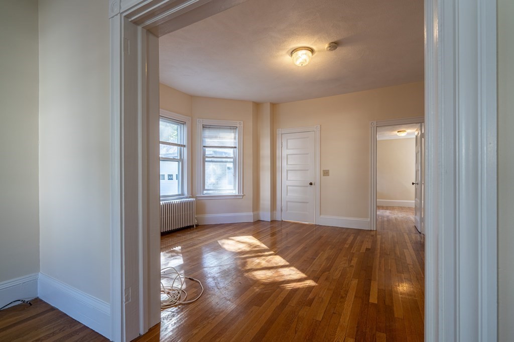 55 Waldeck Road Milton, MA 02186 - Photo 17 of 28 a view of empty room with wooden floor and fan
