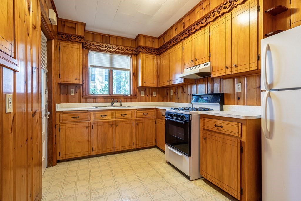 55 Waldeck Road Milton, MA 02186 - Photo 20 of 28 a kitchen with stainless steel appliances granite countertop a stove a sink and a refrigerator