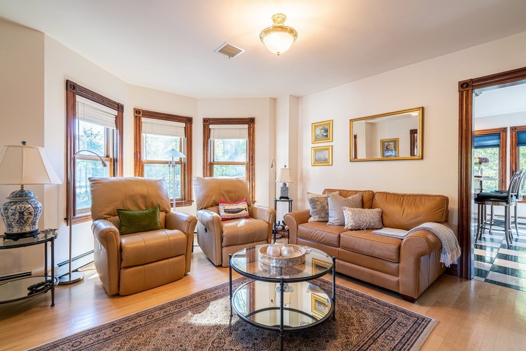 55 Waldeck Road Milton, MA 02186 - Photo 5 of 28 a living room with furniture a rug and a window