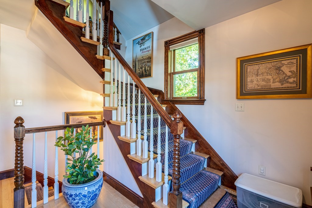 55 Waldeck Road Milton, MA 02186 - Photo 10 of 28 a view of entryway with wooden floor and stairs