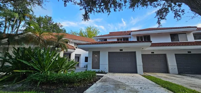 a view of a big room with wooden floor and windows