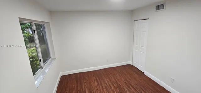 a kitchen with stainless steel appliances wooden cabinets and granite counter tops