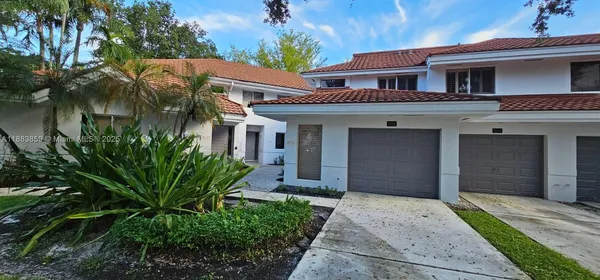 a view of house with outdoor space and swimming pool