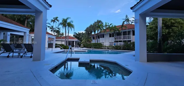 a view of a swimming pool with an ocean view
