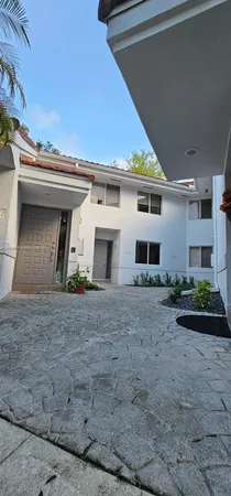 a view of outdoor space with palm trees
