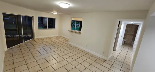 a view of an empty room and window