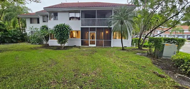 a bathroom with a glass door and shower