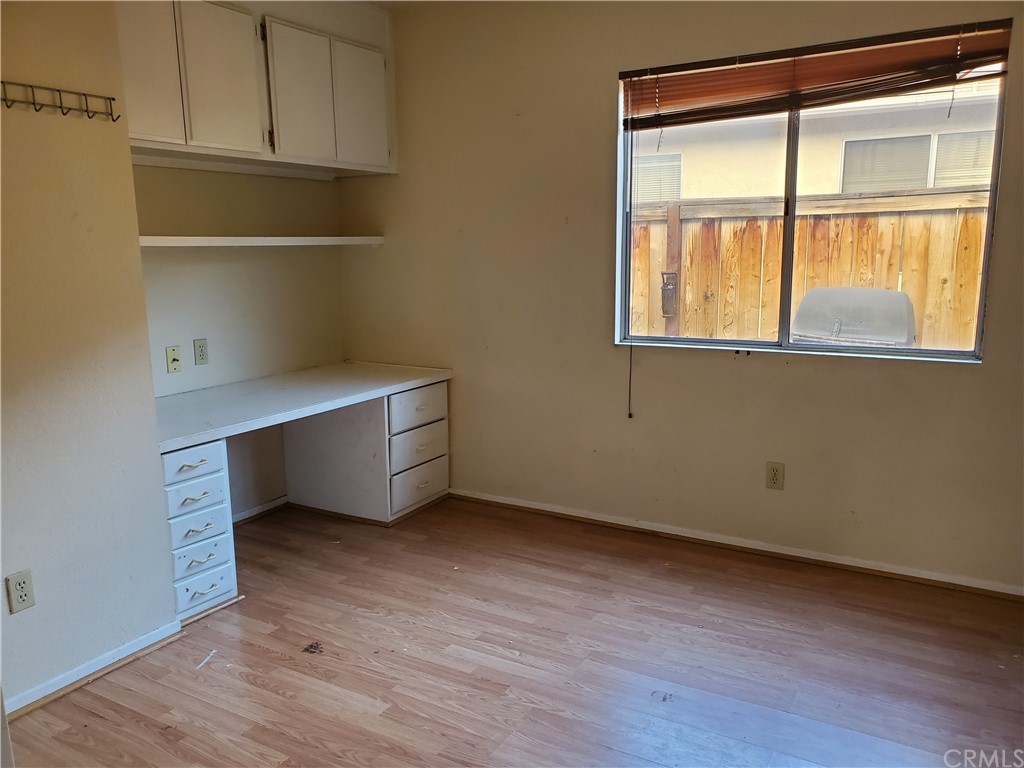 39837 Falcon Way Murrieta, CA 92562 - Photo 7 of 12 a room with wooden floor and window