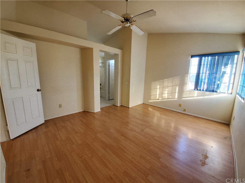 39837 Falcon Way Murrieta, CA 92562 - Photo 10 of 12 an empty room with wooden floor and windows