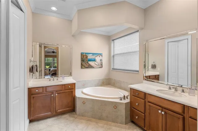 a bathroom with a granite countertop sink mirror bathtub and toilet