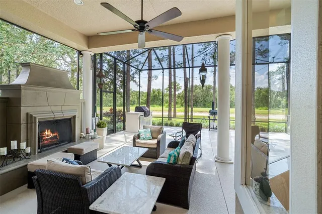a view of a patio with a table and chairs a barbeque with wooden floor and fence