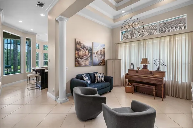 a living room with furniture and a large window