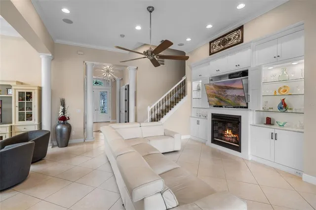 a living room with furniture and a fireplace