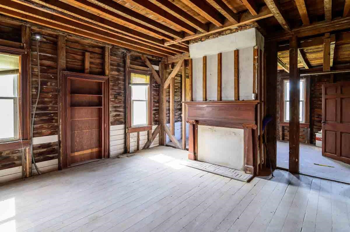 4976 Ross West Road Dunn, NC 28334 - Photo 2 of 20 a view of an empty room with a fireplace and a window