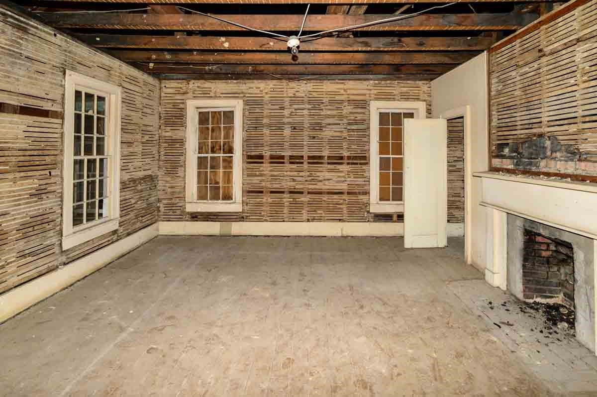 4976 Ross West Road Dunn, NC 28334 - Photo 9 of 20 a view of an empty room with a fireplace