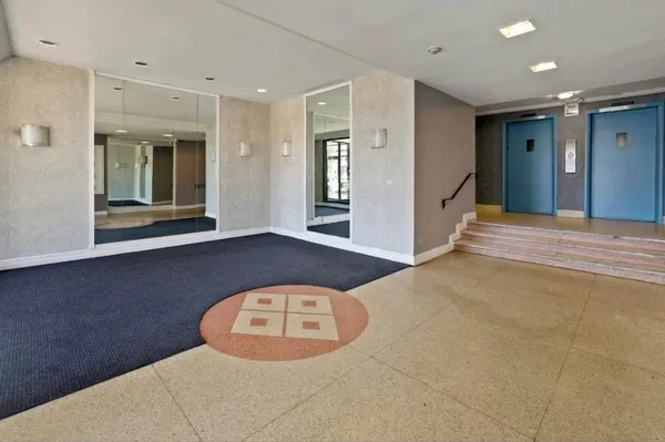 a view of a hallway with a large window