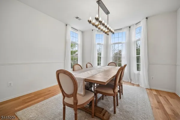 a kitchen with a sink window and cabinets