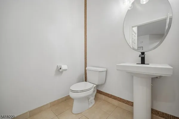 a bathroom with double sink and a mirror