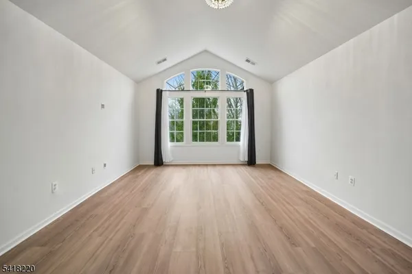 a view of a balcony with a floor to ceiling window