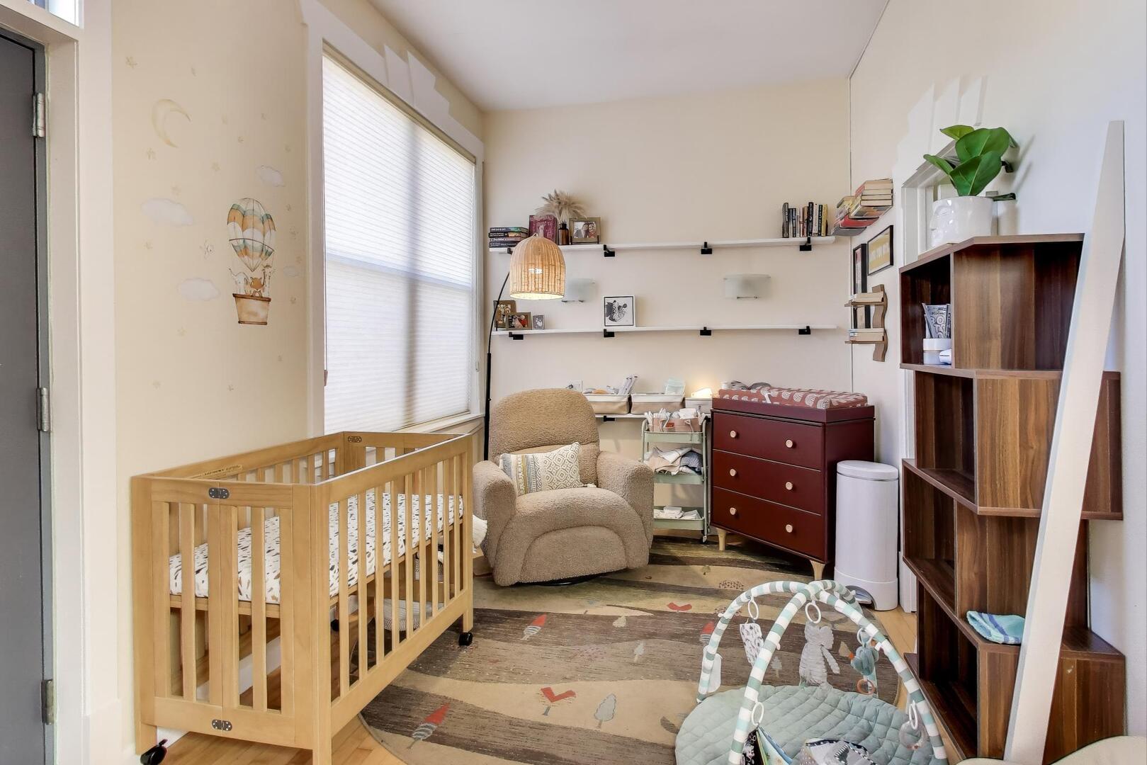 400 North Racine Avenue, Unit 204 Chicago, IL 60642 - Photo 15 of 22 a bedroom with furniture and a book shelf